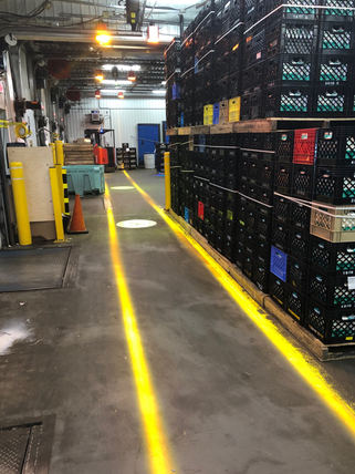 VirtuaLine amber Projected Lines used to outline caution lines at a warehouse